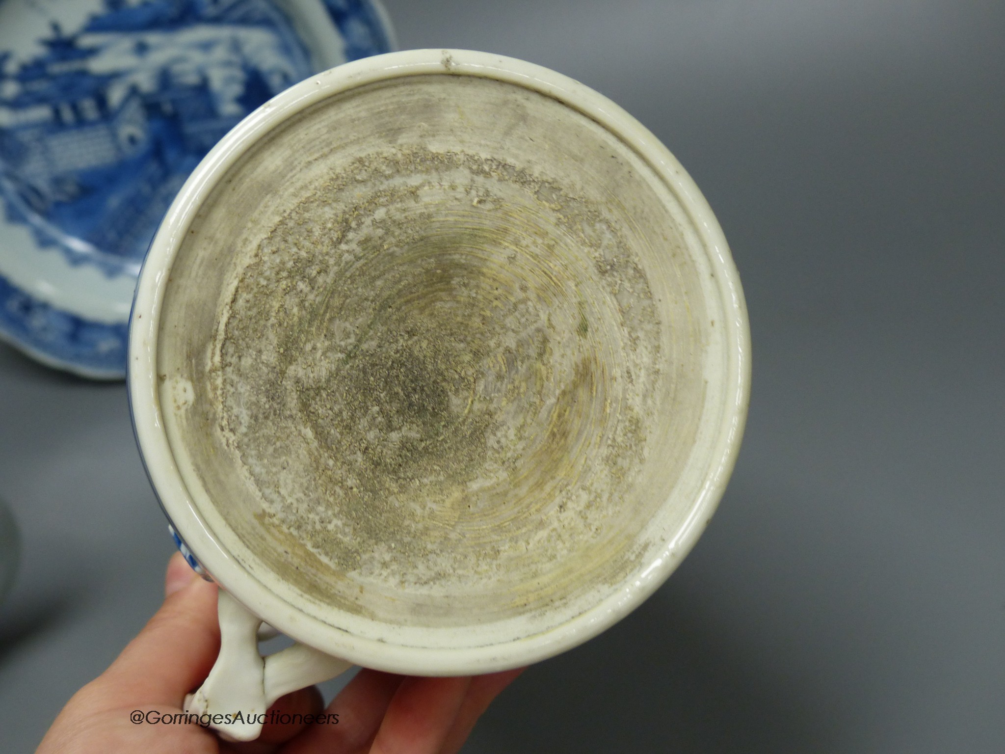 An 18th century Chinese blue and white mug, plate and saucer, largest 23cm diameter